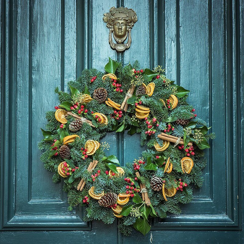 Autumn fall foliage wreath hanging on an apartment front door