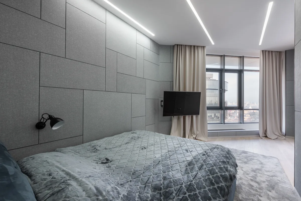 Daybed on a carpeted floor near a bright apartment window