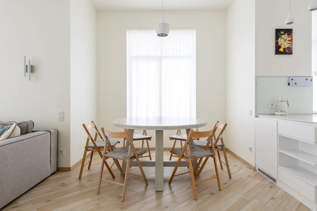 Compact dining table with chairs in a small apartment nook