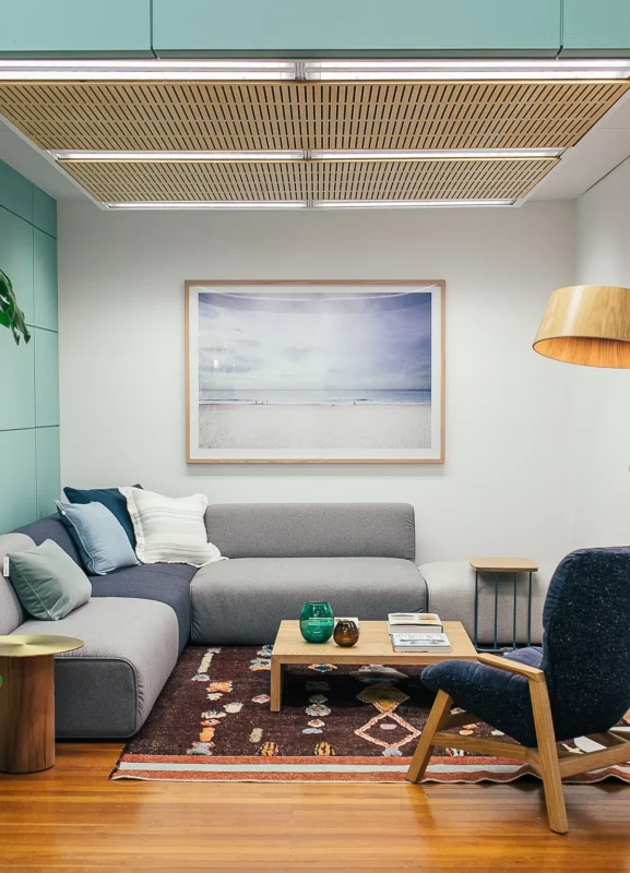 Cozy living room with sofa, armchair and wooden coffee table