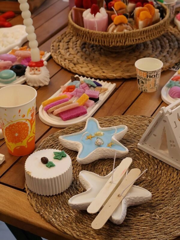 Handmade decorative candles on table, dollar store candle decorating DIY