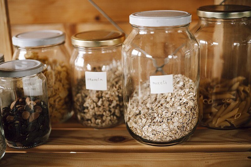 Glass pantry jars on wooden shelf, dollar store kitchen canister set