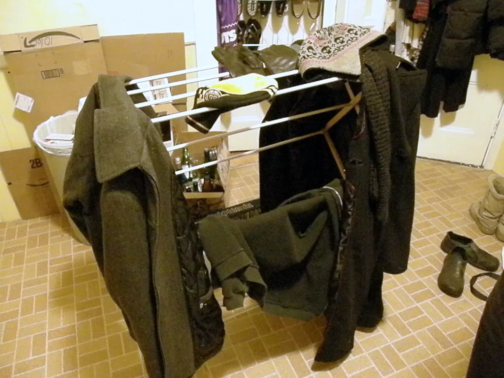 Folding drying rack holding jackets