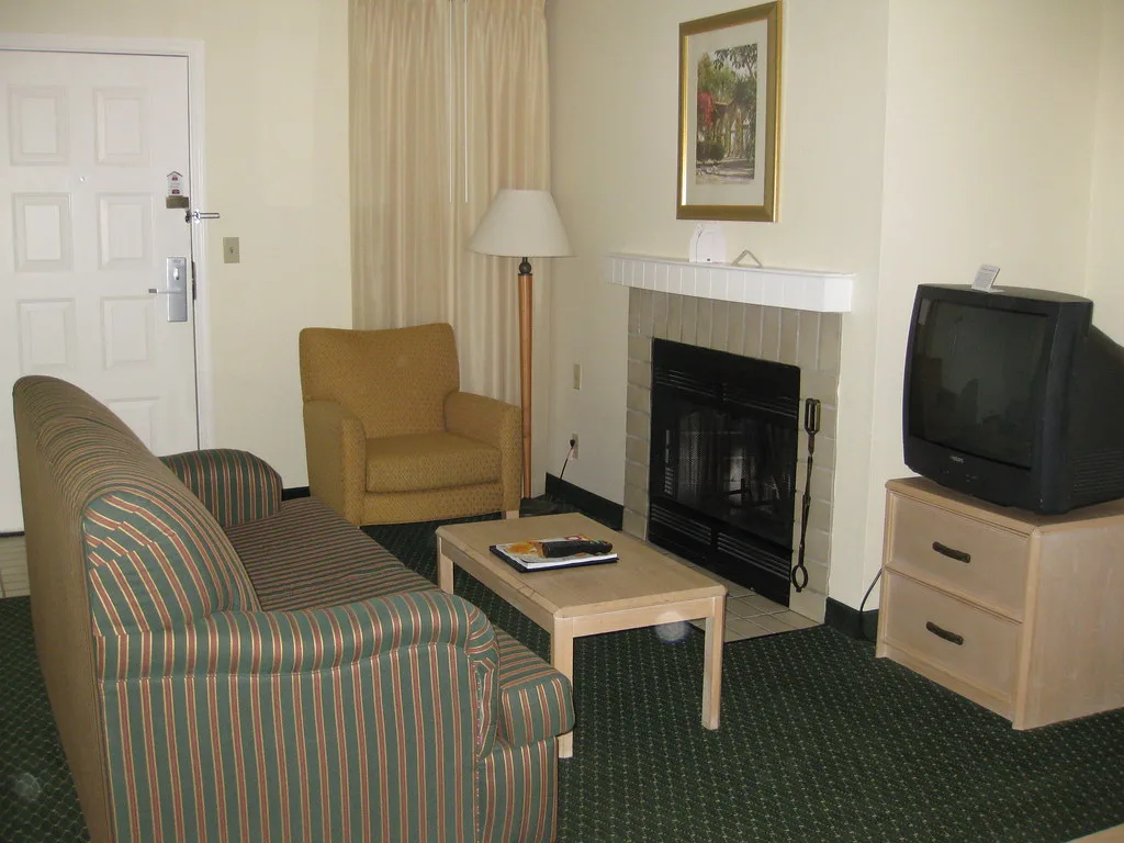 Living room with area rug under the coffee table
