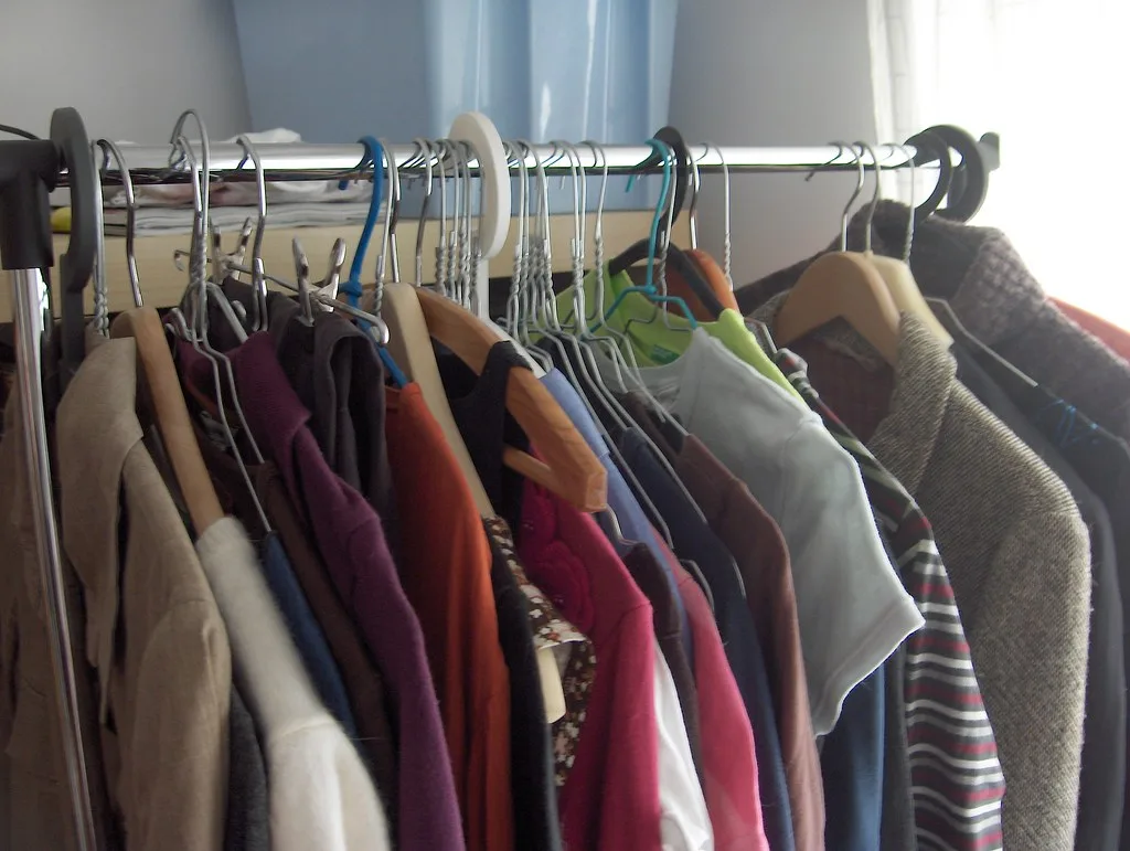 Freestanding garment rack with clothes