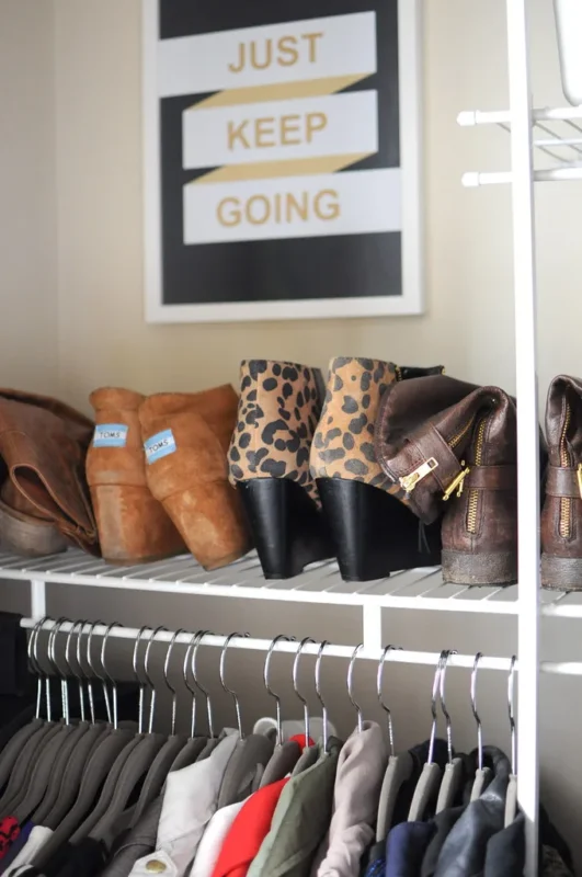 Organized rental closet with shoes on a wire shelf