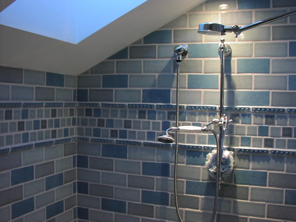 Tiled shower interior with dual shower heads