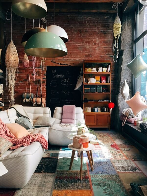 Furnished small living room with budget throw pillows and soft textiles for cozy apartment decor
