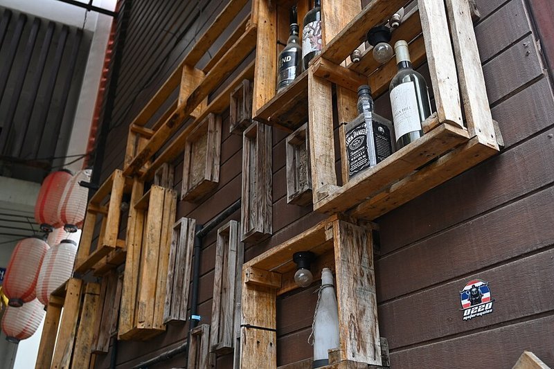 Rustic wooden crates repurposed as DIY wall-mounted shelves for budget small apartment storage