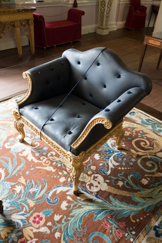 Vintage upholstered armchair ready for a thrift store reupholstery furniture flip project