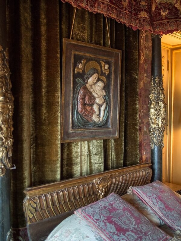 Restored carved wooden headboard in a vintage bedroom, thrift store headboard flip result