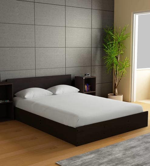 Bed with built-in box storage drawers for under-bed storage in a tiny house bedroom