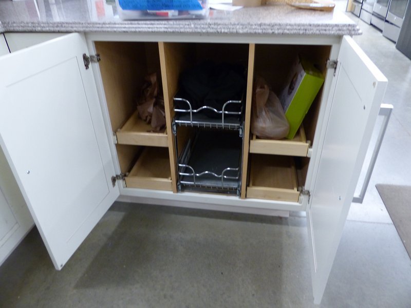 Kitchen base cabinet fitted with pull-out interior drawers for easy access