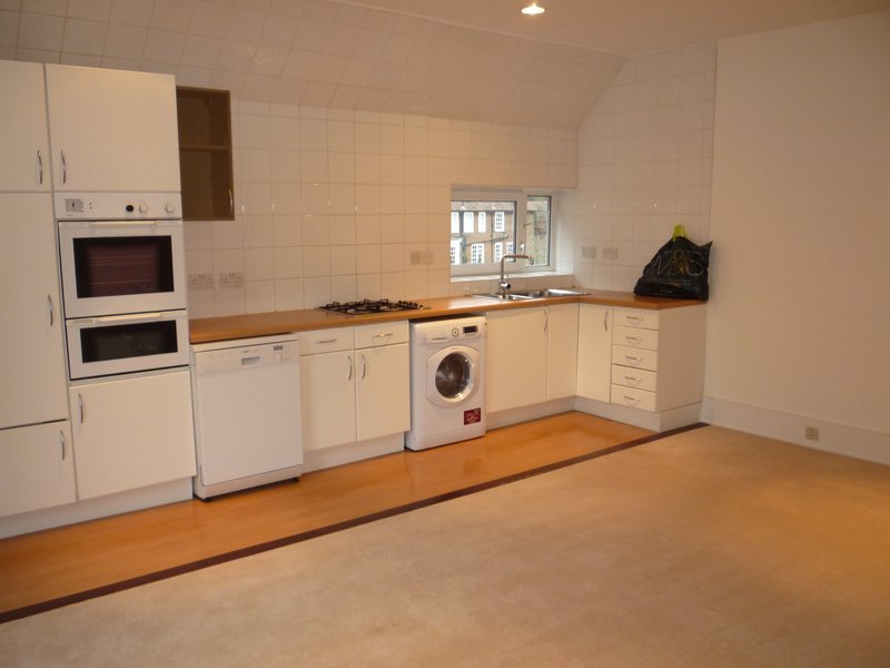 Compact tiny house kitchen with smart layout and space-saving storage zones