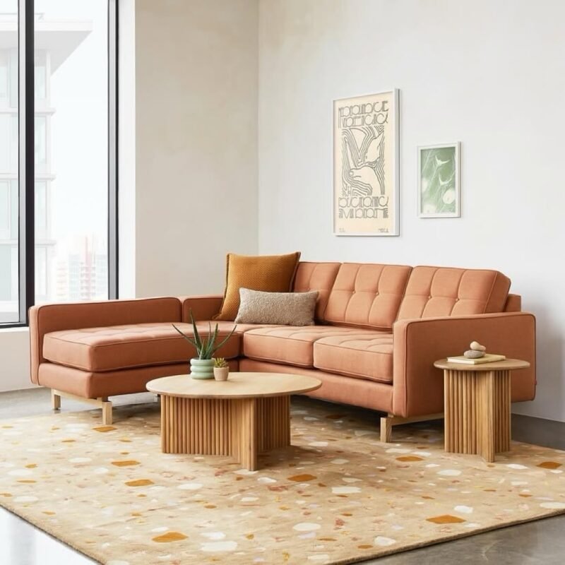 Minimal modern living room with terracotta sectional sofa and wooden tables