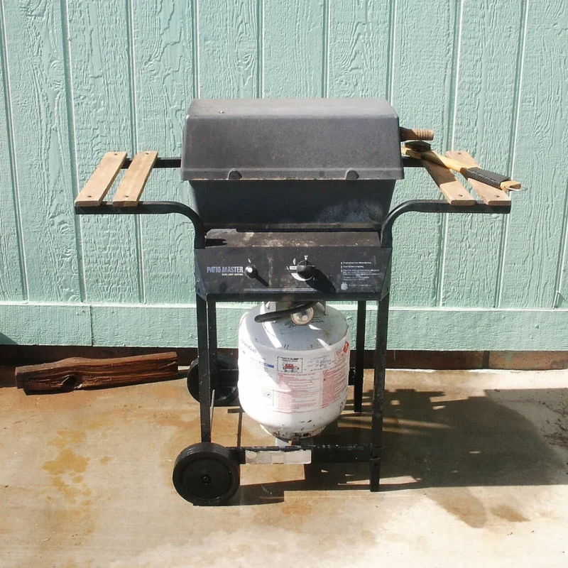 Small propane grill set up on a patio