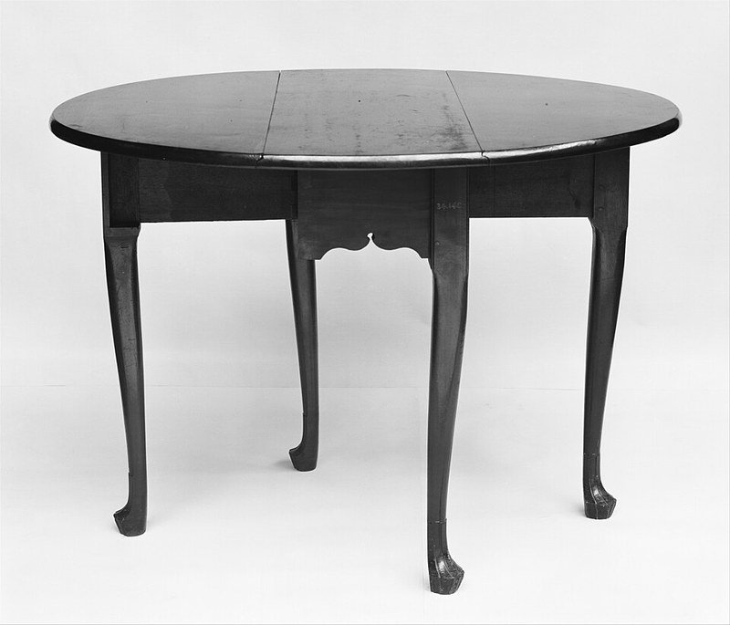 Drop-leaf table that folds down to save space in a small living room