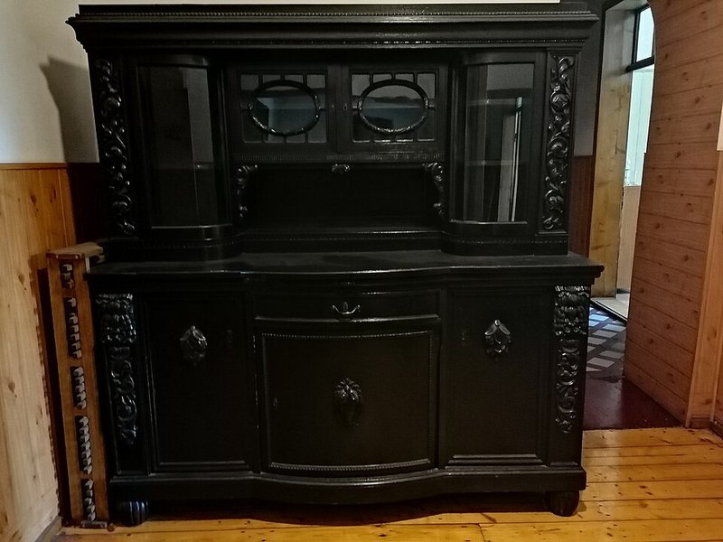 Closed-door wooden sideboard hiding everyday clutter out of sight