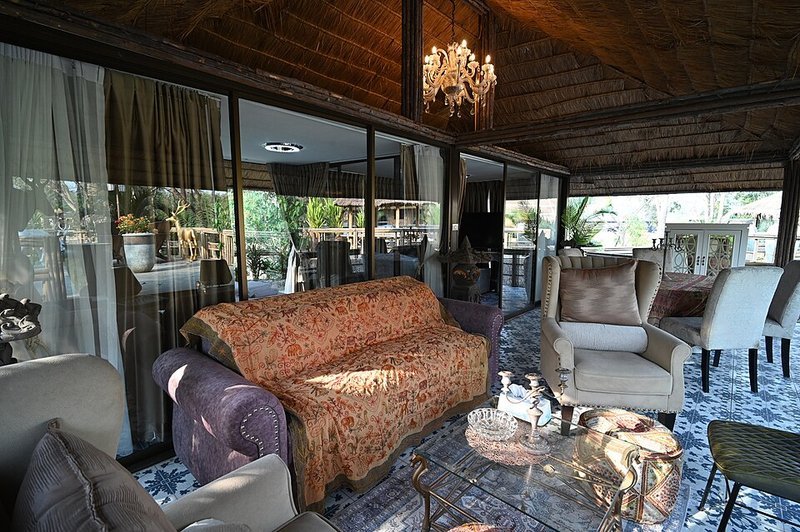 Cozy lounge with a patterned throw cushions and rug layering soft textiles